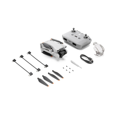 DJI Mini 3 con control remoto, baterías y accesorios para vuelo